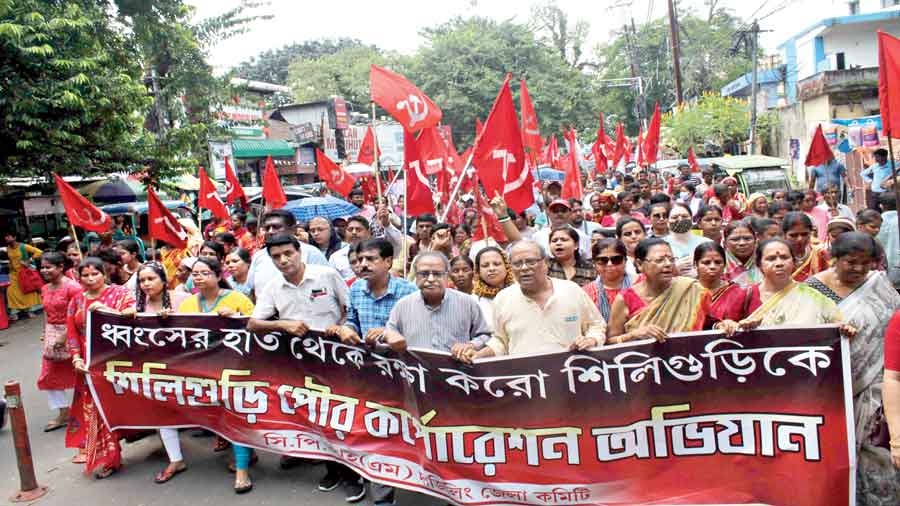 Asok Bhattacharya - CPM marches against Siliguri Municipal Corporation ...