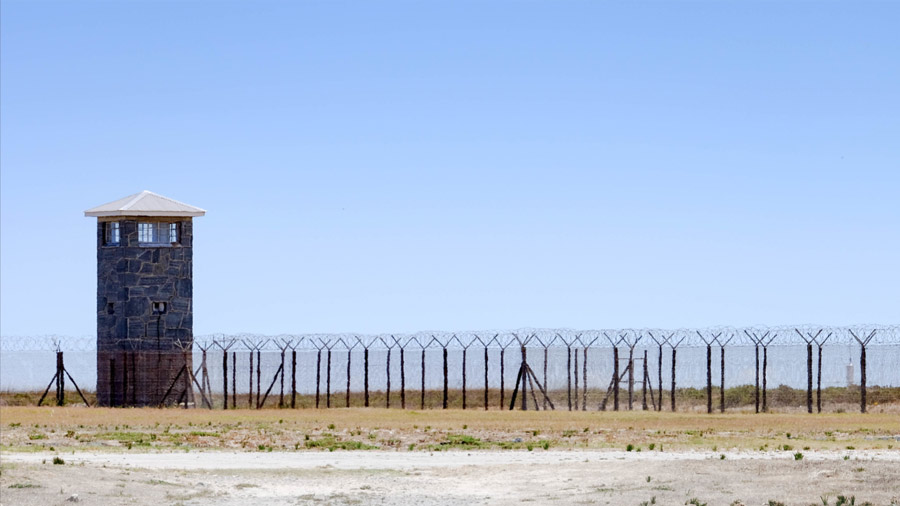 A watch tower and barbed wires remind visitors of what Robben Island used to be