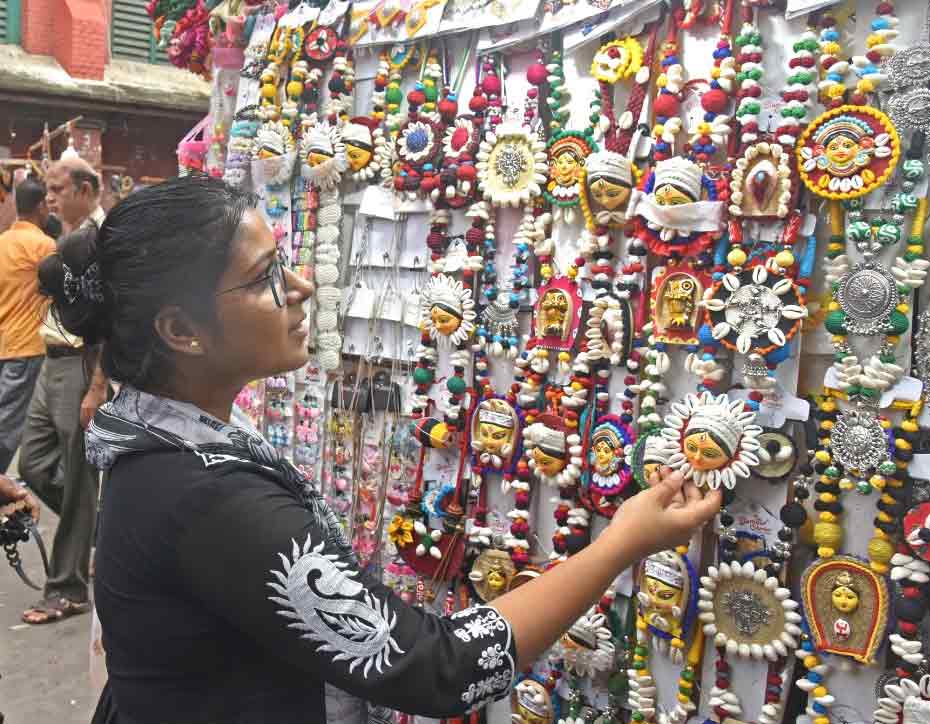 A girl checks out junk jewellery near Esplanade on Saturday.