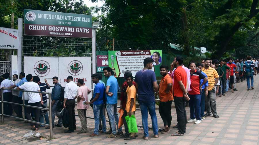 Football lovers queue up outside Mohun Bagan Athletic Club for Kolkata Derby tickets on Saturday. East Bengal take on ATK Mohun Bagan on Sunday for a Durand Cup match at Salt Lake Stadium.