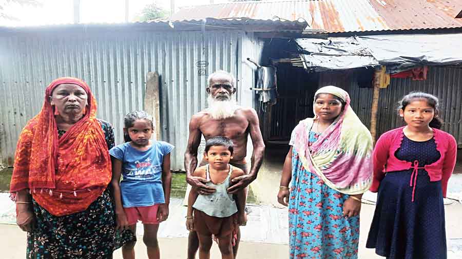 Samsher Ali with his family members at the house of the panchayat member in Mallickshova village.