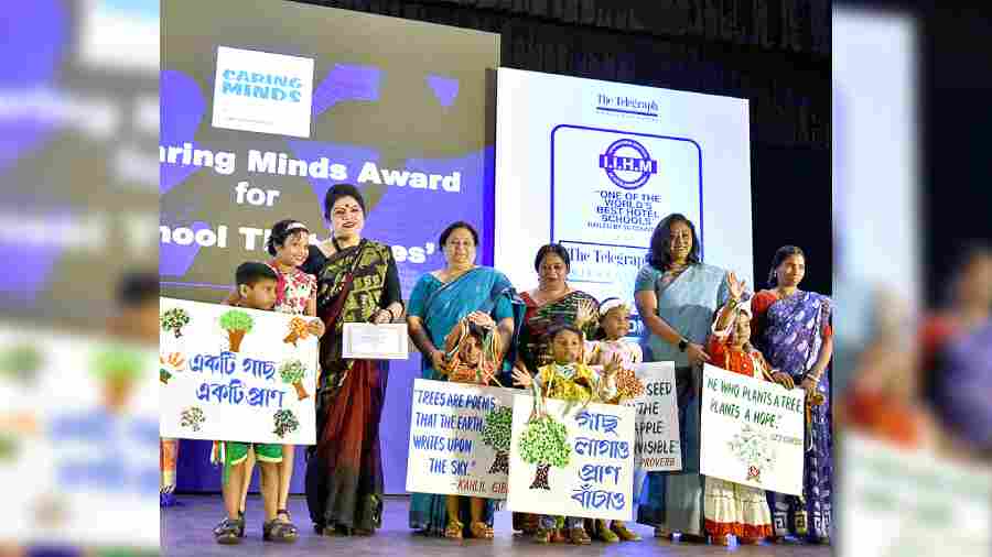 Carrying placards, children from Ankur, an NGO-run school, collect their certificate for The Caring Minds Awards for A School that Cares at the inaugural ceremony of IIHM presents The Telegraph School Awards for Excellence 2022 at South City International School on Saturday. 