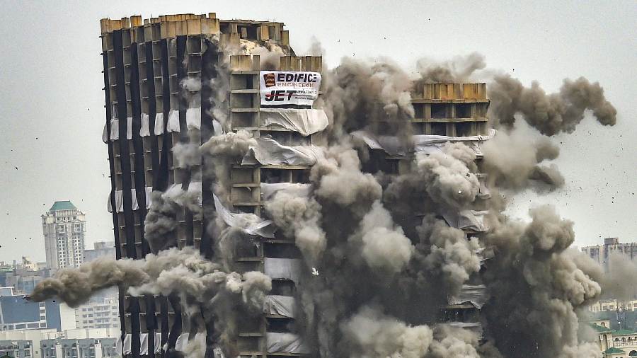 Close-up shot of Supertech's twin towers falling down