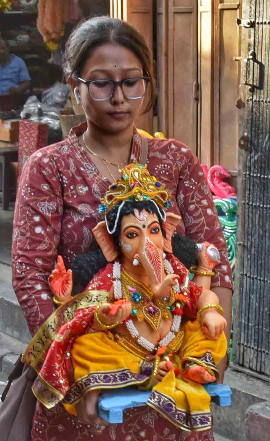 A woman carries an idol of Ganesh at Kumartuli on Tuesday. According to Drik Panchang, the festival is celebrated in the Shukla Paksha of the Bhadrapada month which, as per the Gregorian calendar, falls in August or September. This year, Ganesh Chaturthi will begin on August 31.