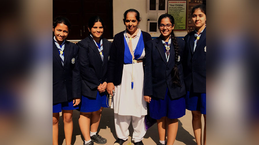 Iman (second from left) during her school days with her scout and guide mentor Ravneet Khurana