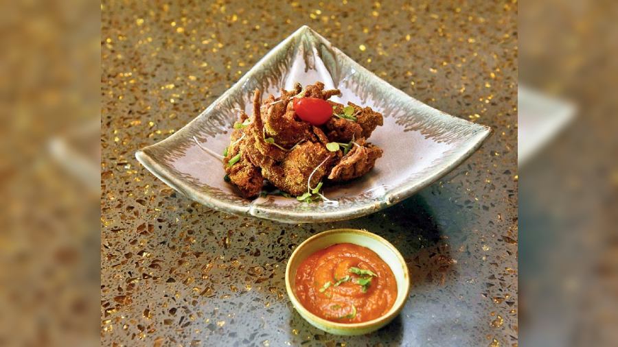 Soft Shell Crab 65: Seafood lovers, dig into this soft-shell crab starter that is made with South Indian spices, dusted with tempura, sooji and rice flavour and thrice fried, that adds the super crunch! The spicy podi powder is dusted on top that accentuates the juicy crab and is served with cherry tomato chutney.
