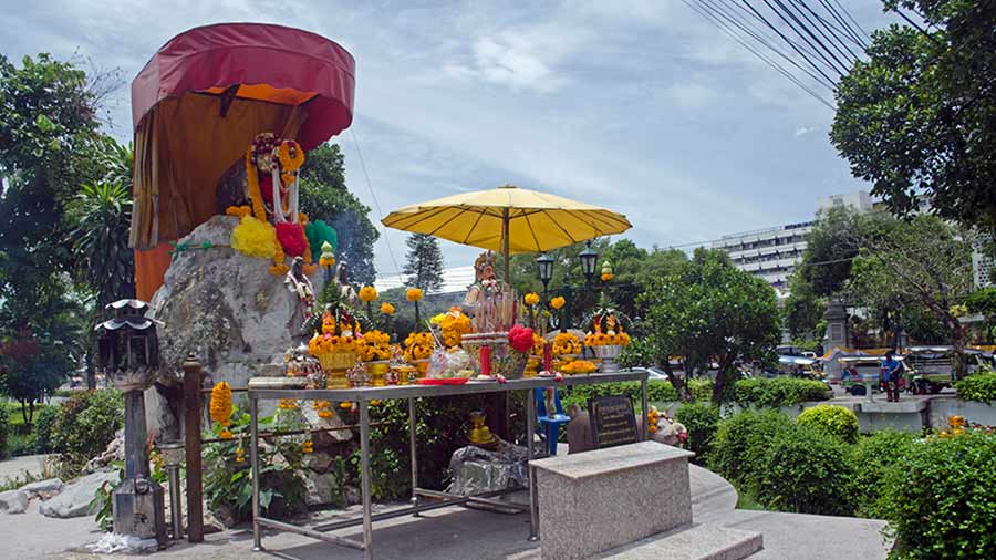 Bangkok’s Pig Memorial, an offbeat stop for most tourists, stands adorned with flower garlands