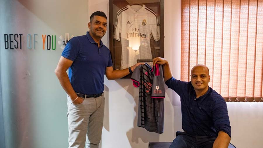Saurav Chatterjee (left) and Anuj Kichlu holding the jersey of Marbella FC, a Spanish club owned by Best of You