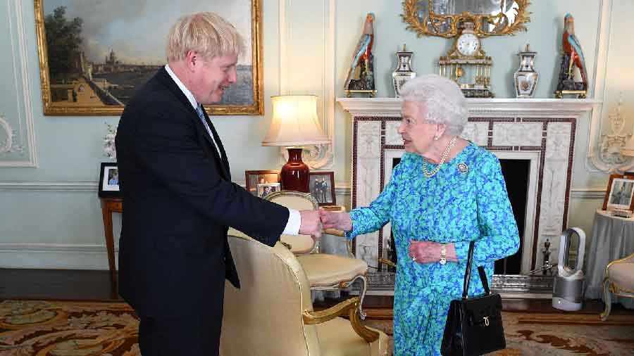 Boris Johnson (L) with Queen Elizabeth
