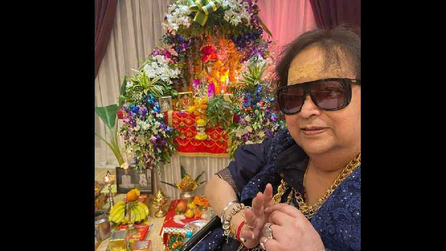 Bappi Lahiri's official Instagram handle posted an old photo of the disco king of Bollywood celebrating Ganesh festival