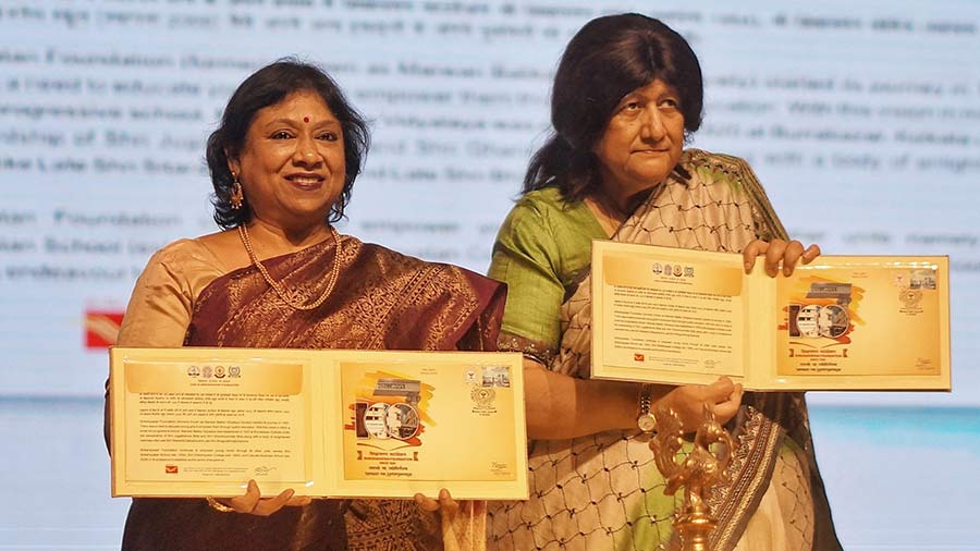 (L-R) J. Charukesi and Justice Indira Banerjee release a coffee-table book on the history of the 100-year-old Shikshayatan Foundation