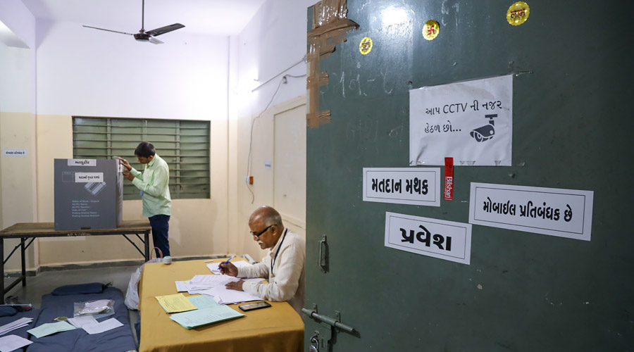 Preparations at a polling station for the first phase of Gujarat Assembly elections in Rajkot.