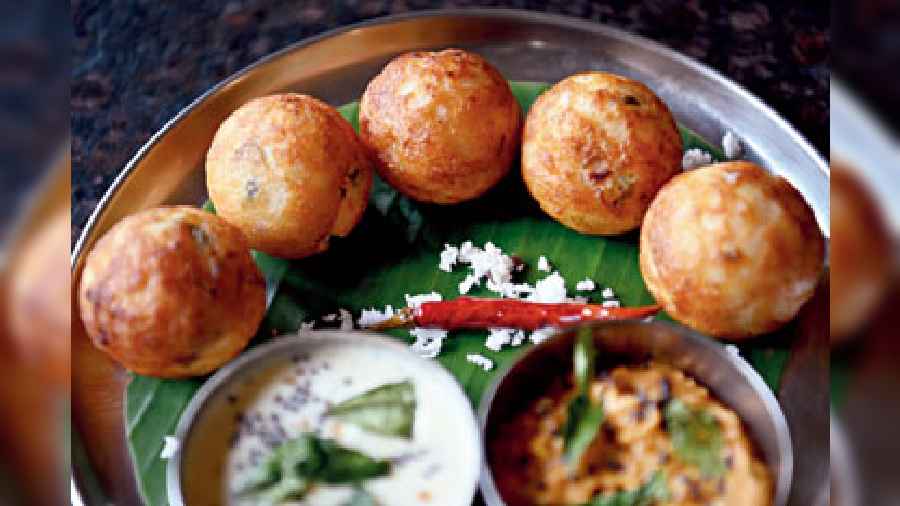 Made with white rice and urad dal, Kuzhi Paniyaram is cooked in a typical South Indian utensil or mould with  very little oil.