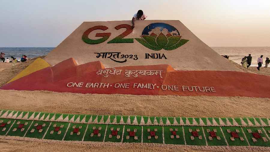 Sand artist Sudarshan Pattnaik creates a sand art on G20: India 2023, at Puri beach
