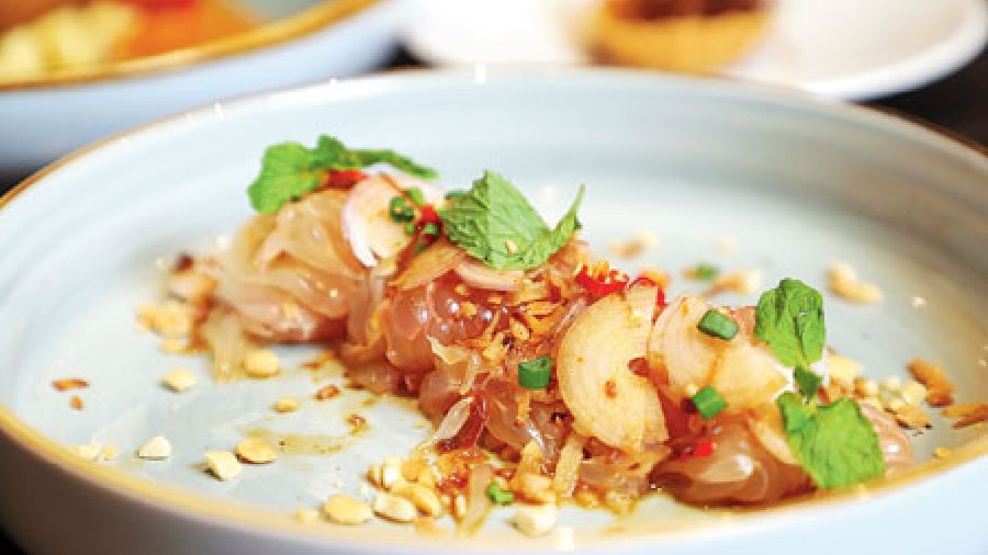 Yum Som O: Made with fresh pomelo, grilled tiger prawns with a mild lime-chilli sauce, this salad has pepper and salt marinated prawns that finely balance the tangy and spicy quotient of the dish.