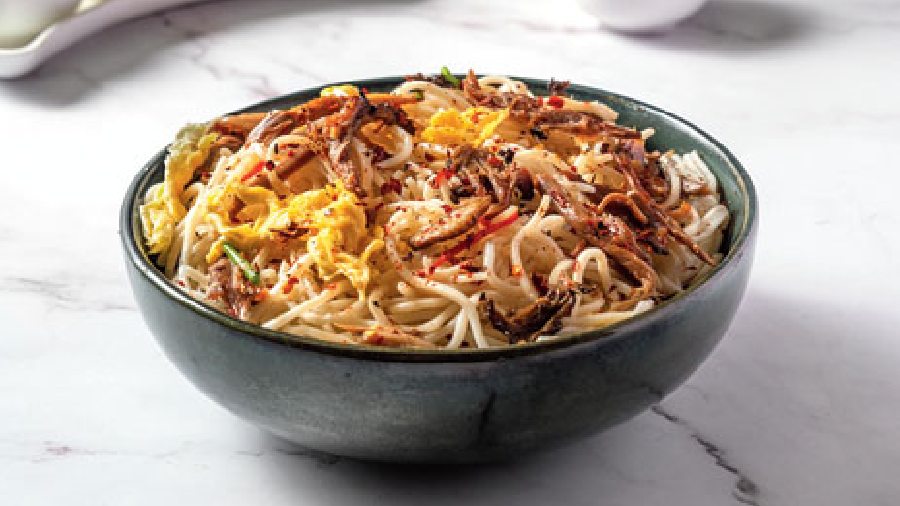 Butter Chilli Garlic Duck Meat & Egg Noodles: Delectable spicy roasted duck strips tossed with noodles in a perfect blend of butter and chopped garlic, topped with chilli flakes. A comforting bowl for sure.