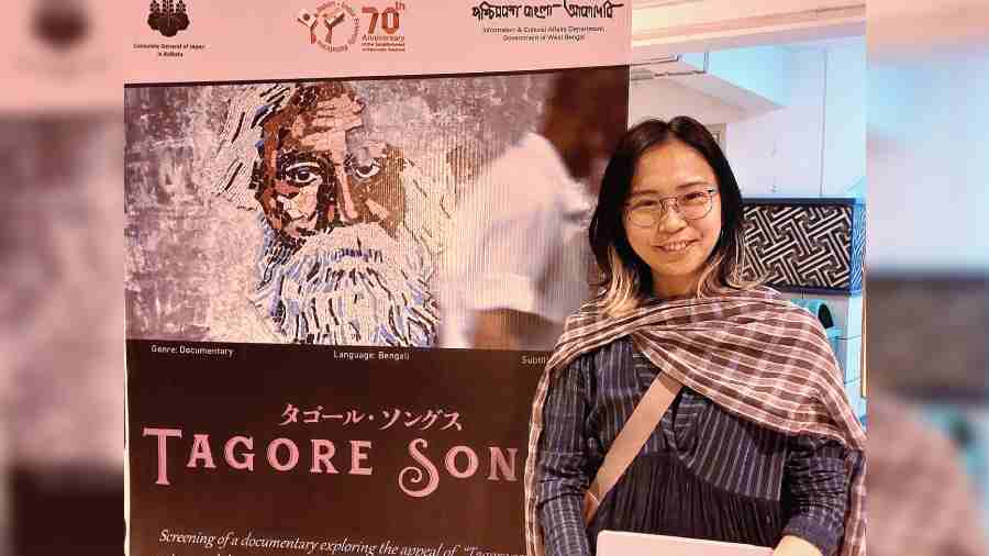 Sasaki Mika poses with a poster of her film ‘Tagore Songs’ at Rabindra Okakura Bhavan. 
