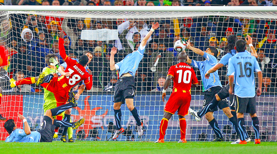 Uruguay’s Luis Suarez handles the ball on the goal line, for which he is sent off, during their 2010 World Cup quarter final against Ghana in Johannesburg in July 2010.