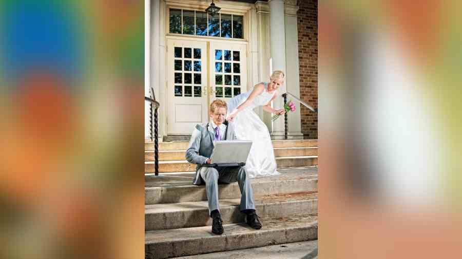 Recently, a photograph went viral showing a groom working on his laptop while sitting in the mandap in his wedding attire.