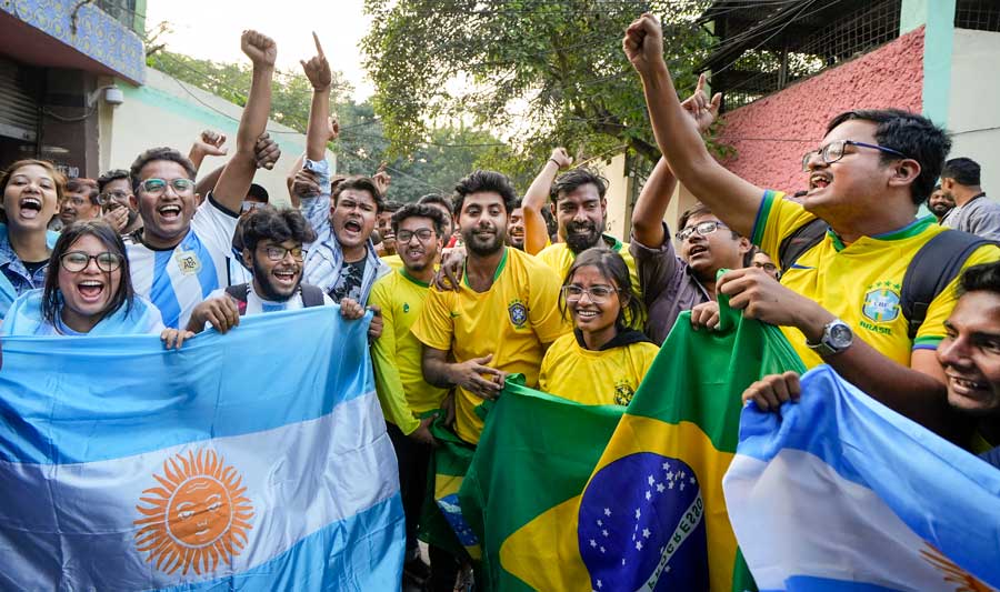 SFI activists wearing jerseys of soccer playing nations participate in a 'March for Harmony' ahead of their 17th All India Conference in Kolkata on Friday