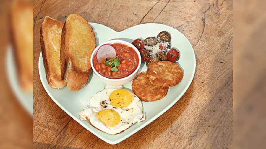 Classic As You Like It: Get this wholesome breakfast tray for a fulfilling bite. It comprises of three eggs to order, a mildly tangy side of baked beans, creamy and richly sauteed mushrooms, soft, roasted hashbrowns and toasted sourdough. Bacon can also be added on request. (Rs 395)