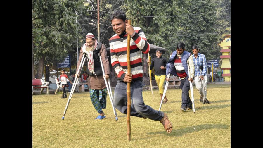 People with disabilities participate in a crutches race organised in Moradabad. 