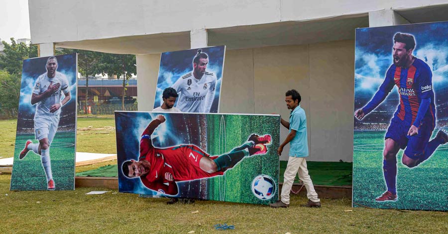 Huge posters of footballers being set up at a football fan village in Kolkata as city fans gear up for the Round of 16 stage of FIFA World Cup 2022. Over the next four days, top two teams from each group that progressed will fight it out in the hope of winning the coveted trophy. In the knock-out stage, the teams play each other once, with the winning team going to the next round