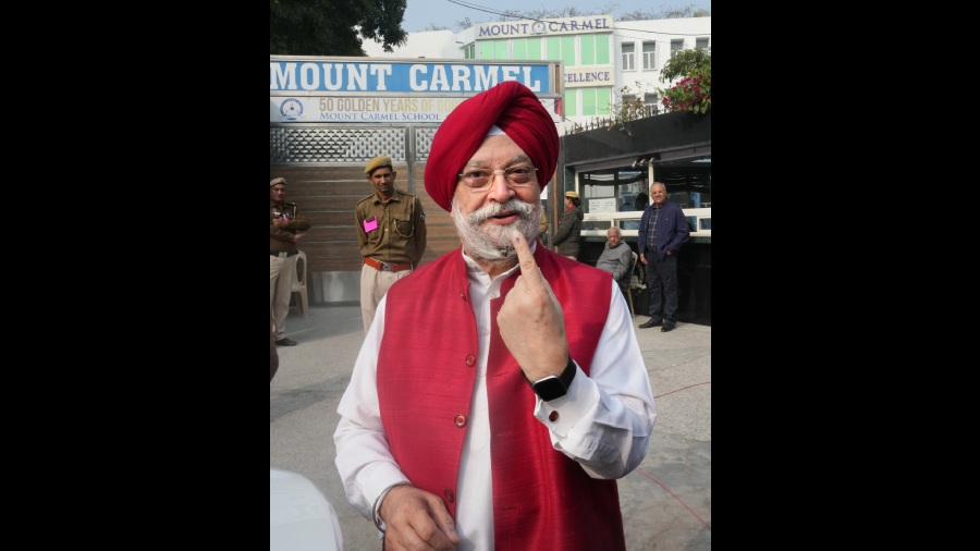 Union Minister Hardeep Singh Puri also at the polling booth after casting his vote.