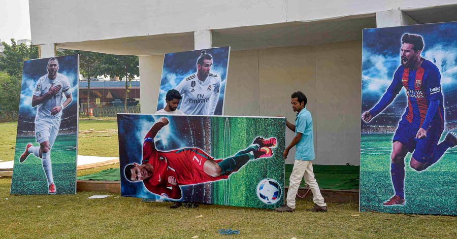 Huge posters of footballers being set up at a football fan village in Kolkata on Saturday as city fans gear up for the Round of 16 stage of FIFA World Cup 2022. Over the next four days, top two teams from each group that progressed will fight it out in the hope of winning the coveted trophy. In the knock-out stage, the teams play each other once, with the winning team going to the next round