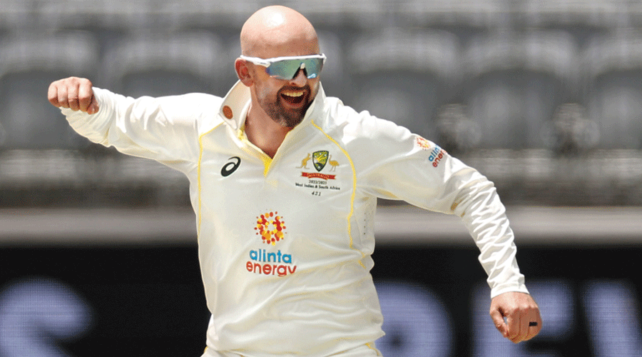 Nathan Lyon of Australia celebrates after dismissing Kraigg Brathwaite of the West Indies on Day V of the first Test in Perth on Sunday.