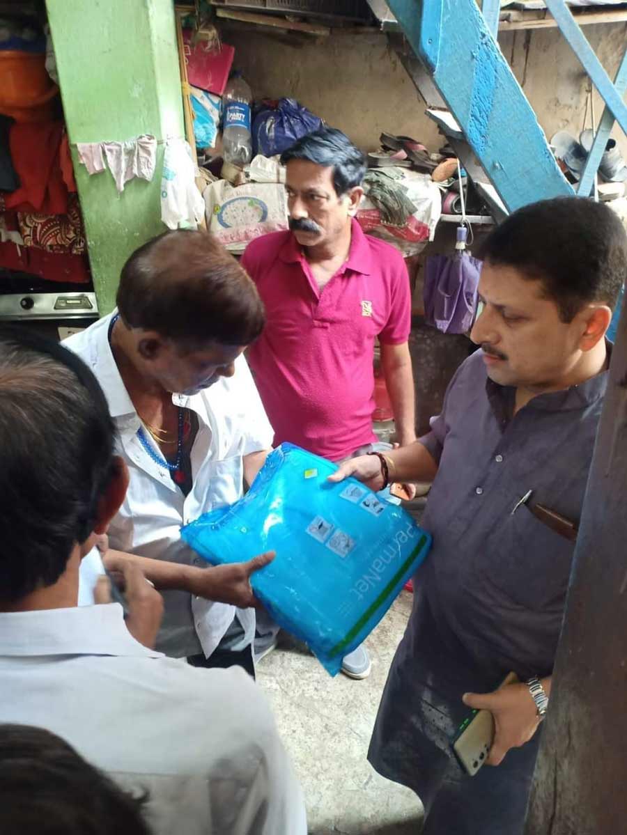 Mosquito net distribution as part of a dengue awareness drive in Ward 25, Kolkata