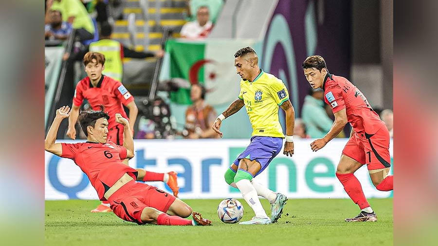 Players of South Korea and Brazil in action during their World Cup match