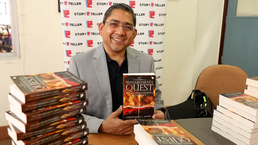 Author Christopher C. Doyle poses with his book ‘the Mahabharat Quest’