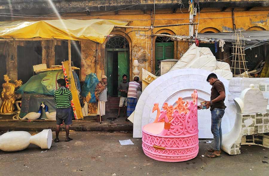 As the city enjoys the wedding season, an artist prepares a wedding prop at Dompara on Tuesday