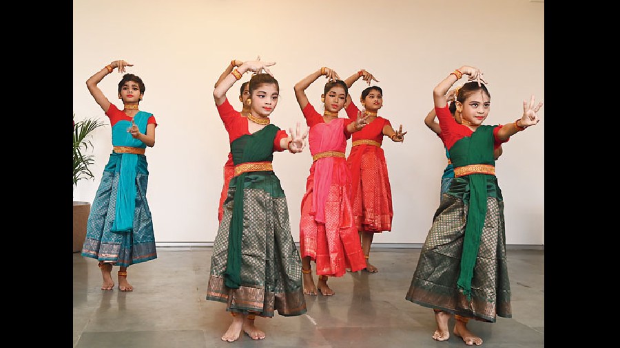 Students of the school present a dance sequence to welcome guests