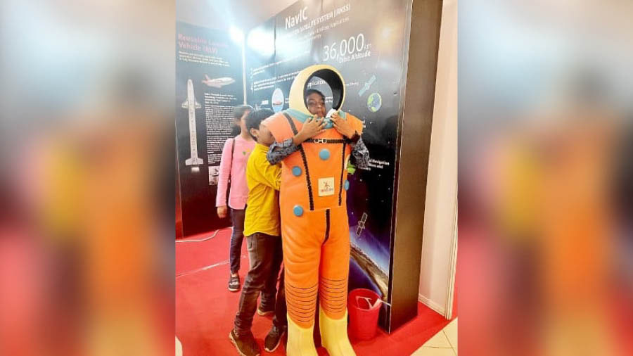 Kids take selfies at the astronaut selfie point at the National Space Science Exhibition at Science City on Wednesday