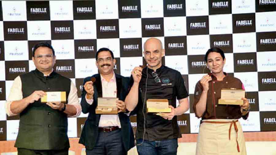 (L-R) Anuj Rustagi, COO, chocolates, coffee, confectionary and new category development of ITC Foods Ltd, Mahendra Barve, head of product development confectionary & chocolates, Adriano Zumbo and  master chocolatier Ruby