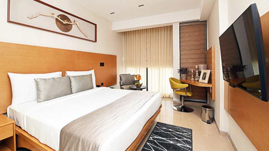 The queen-sized bedroom is nicely done in warm hues and assures you a comfortable stay.