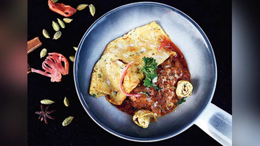 Chicken Patiala: Boneless chicken chunks are prepared in a thick cashew gravy and cream and covered with an omelette on top. It tends to go perfectly with Indian breads!