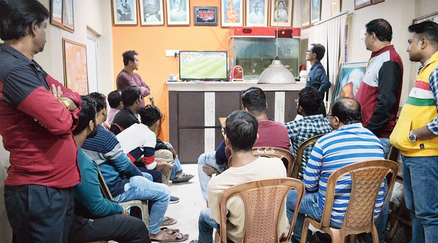 Members watch a Brazil match together at Sukantanagar Culture and Sports Club.