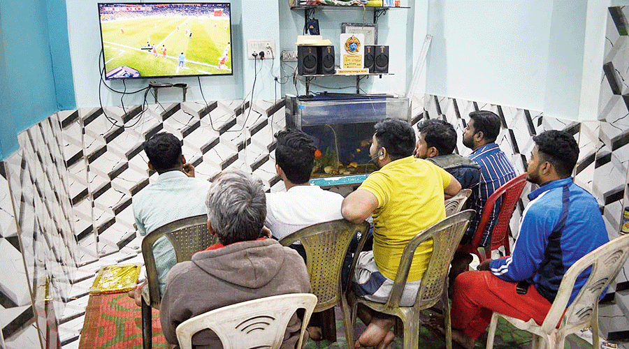 Bidhannagar Nabankur Sangha members watch a match.