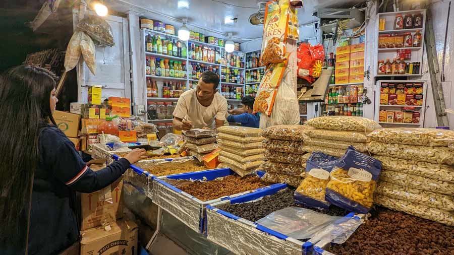 This shop in the rear portion of New Market was crowded on Thursday evening as shoppers picked up cashew nuts, raisins, almonds and spices for cakes 