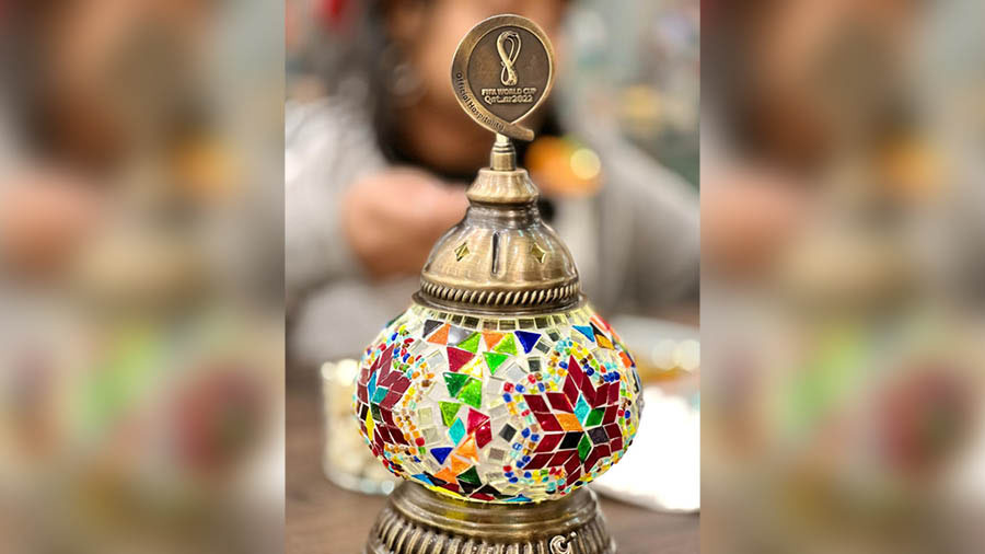 A traditional souvenir from Qatar with the World Cup logo on top