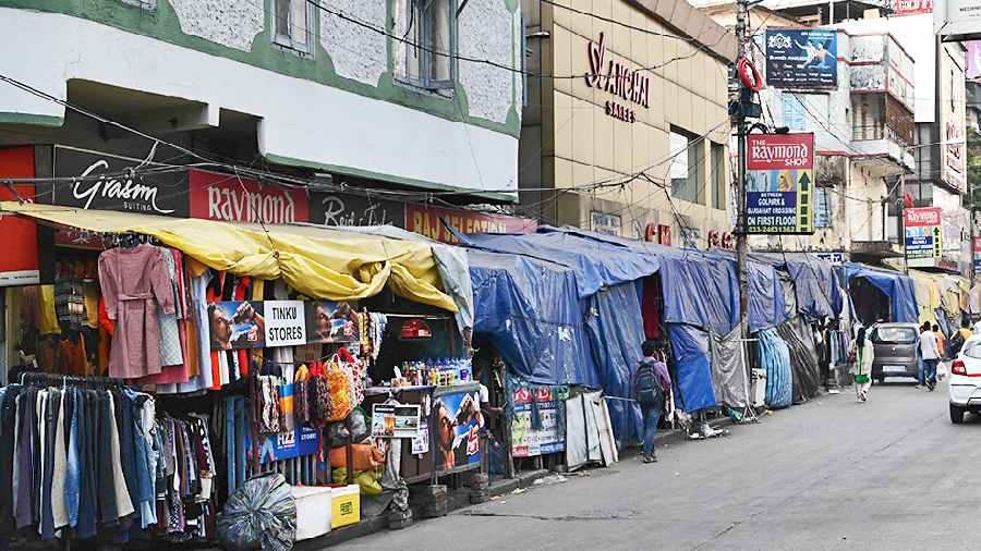 Plastic sheets cover hawkers’ stalls in Gariahat in mid-November
