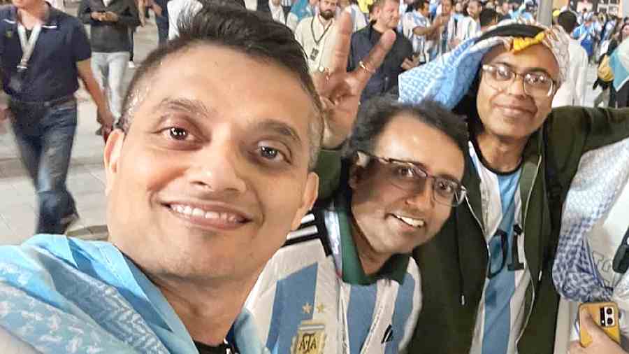 (From left) Sukirti Ghosh, Suryasarathi Dasgupta and Dipanjan Dasgupta outside Lusail stadium on Friday