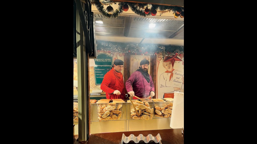 People at this bratwurst stand look like they jumped out of a story book!