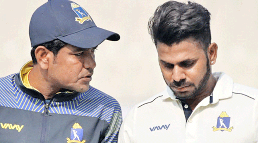 Head coach Laxmi Ratan Shukla (left) with Manoj Tiwary during Bengal’s training session at Eden Gardens on Monday.