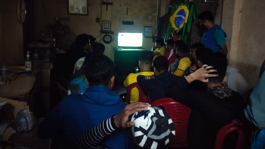 Brazil fans gather to watch the quarter-final against Croatia at Ajay Sanghati Club
