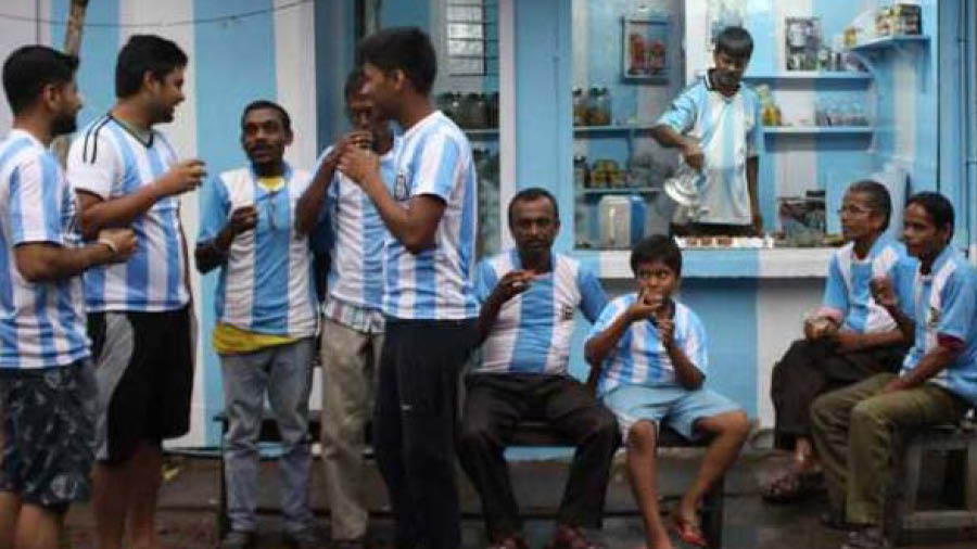 Argentina fans crowd fellow fan Shib Shankar Patra's tea shop in Ichapur