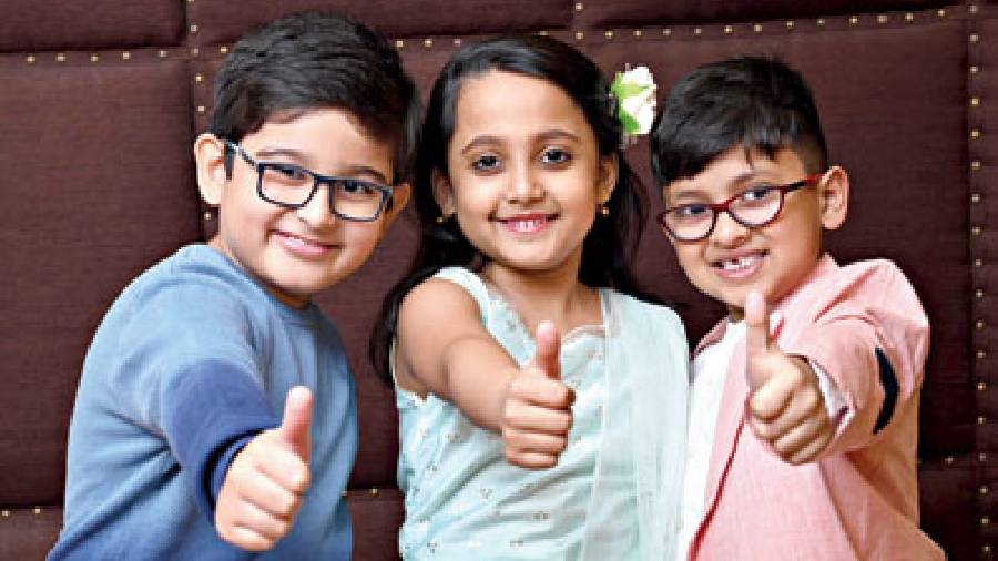 A thumbs up sign by the trio to show how much they enjoyed spending time with team The Telegraph
